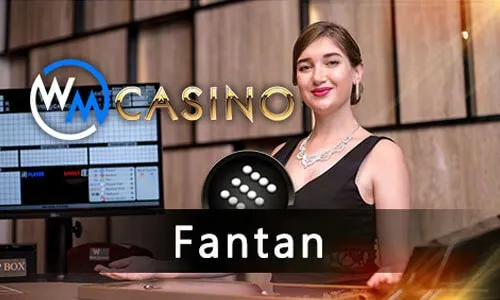 A hand holding a smartphone displaying the 8k8 casino app interface, with various games and a login screen.